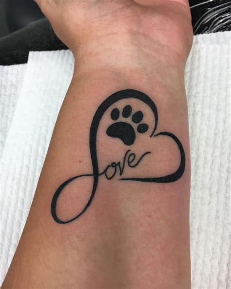 pawprint tattoo designs|unique paw print tattoos.